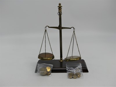 Lot 584 - A set of brass balance scales, h.25cm;...