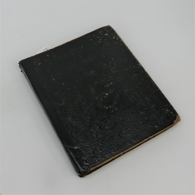 Lot 586 - A Victorian embossed leather album containing...