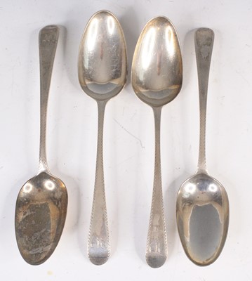 Lot 4122 - A set of four George III silver serving spoons,...