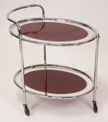 Lot 517 - A mid-20th century tubular chrome oval...