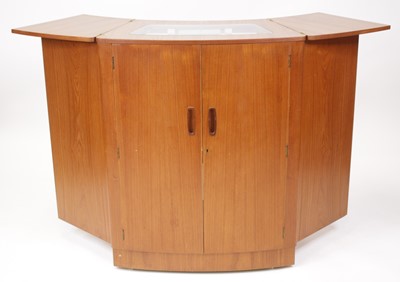 Lot 475 - A 1970s Turnidge teak freestanding bar, of...