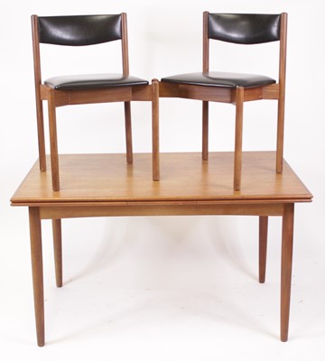 Lot 491 - A 1960s Danish teak dining suite, comprising;...