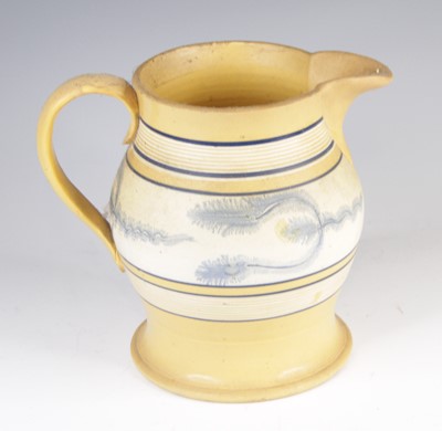 Lot 4018 - A mochaware jug, 19th century, decorated with...