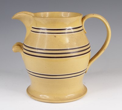 Lot 4019 - A large mochaware jug, 19th century, decorated...