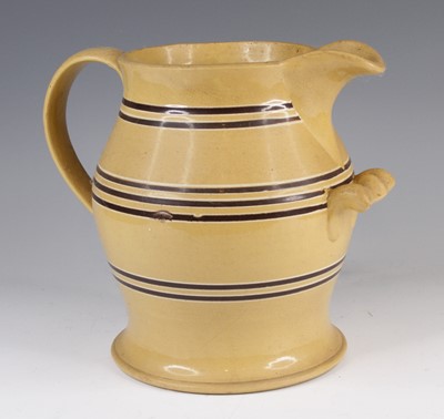 Lot 4019 - A large mochaware jug, 19th century, decorated...