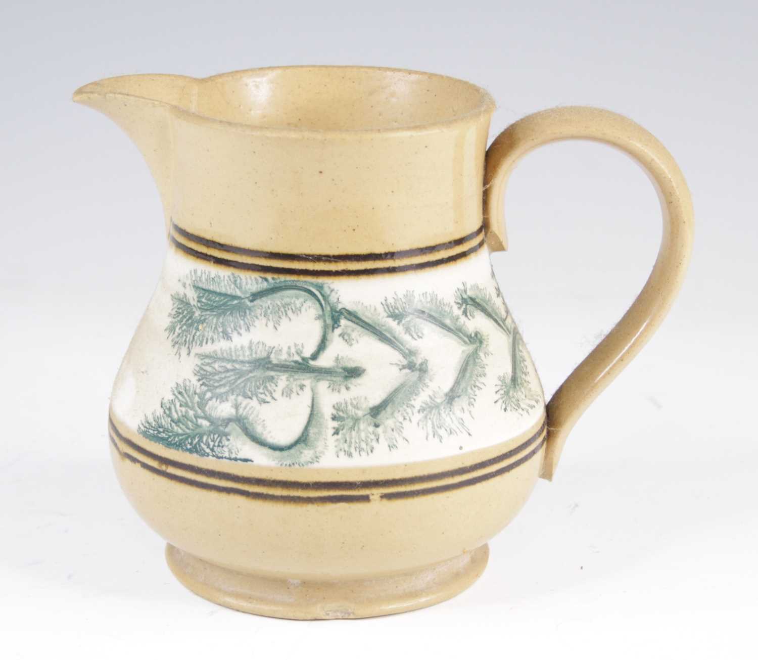 Lot 4017 - A mochaware jug, 19th century, decorated with...