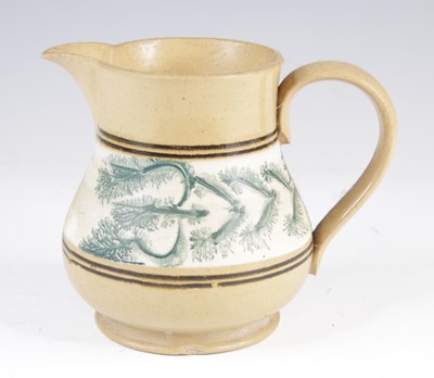 Lot 4017 - A mochaware jug, 19th century, decorated with...
