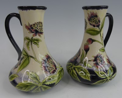 Lot 34 - A pair of Cobridge Stoneware ewers in the...