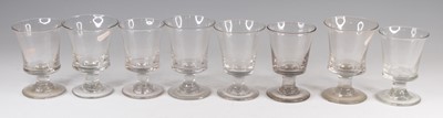 Lot 4093 - A matched set of eight Georgian glass rummers,...