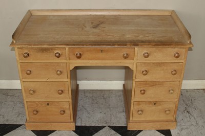 Lot 4428 - A Victorian pine kneehole desk, having a three-...