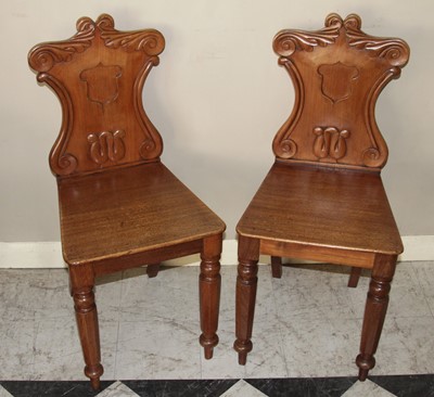 Lot 4495 - A pair of mid-Victorian mahogany panelled seat...