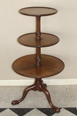 Lot 4508 - A Regency mahogany circular three-tier dumb...