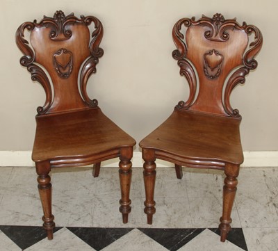 Lot 4421 - A pair of mid-Victorian mahogany floral scroll...