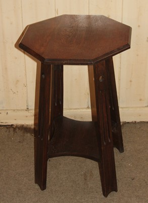 Lot 4456 - An Arts & Crafts oak octagonal two-tier...