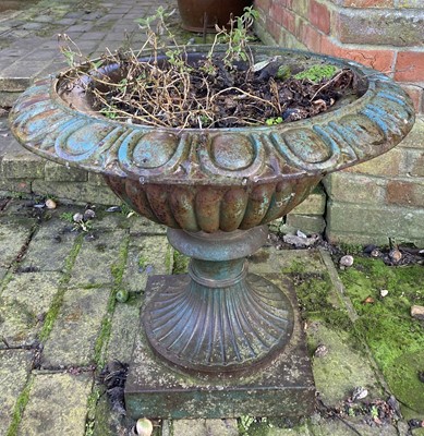 Lot 4544 - A cast iron pedestal garden urn in the...