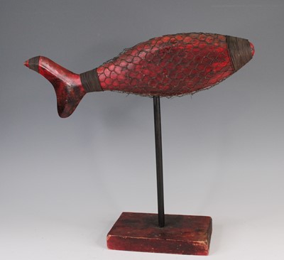 Lot 4205 - A painted carved wood model fish, on rodded...