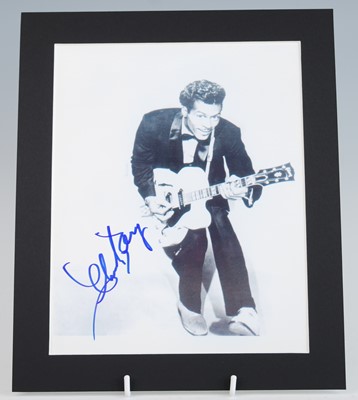 Lot 1139 - Chuck Berry, a 25 x 20cm black and white...