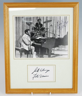 Lot 1153 - Fats Domino, a black and white photograph of...