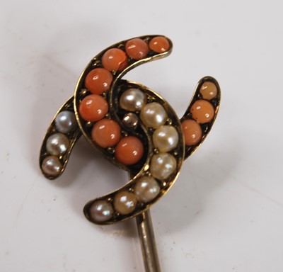 Lot 2563 - A yellow metal, pearl and coral entwined...