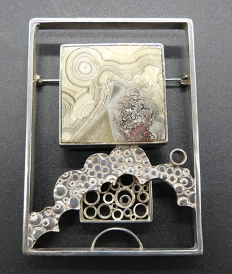 Lot 220 - A 1970s abstract silver square brooch, with...