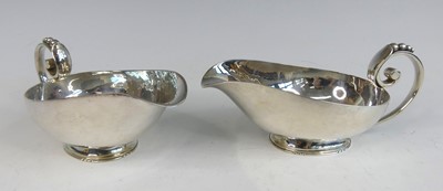 Lot 182 - A pair of late Art Deco silver sauceboats by...