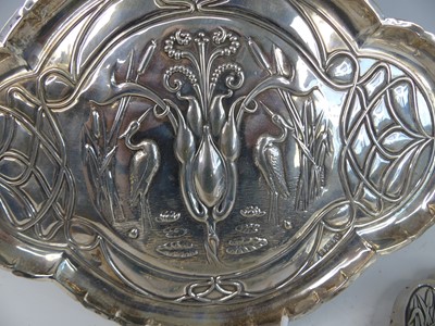 Lot 167 - An Art Nouveau silver five-piece dressing...