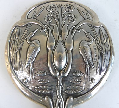 Lot 167 - An Art Nouveau silver five-piece dressing...