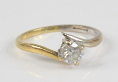 Lot 2339 - An 18ct yellow and white gold diamond single...