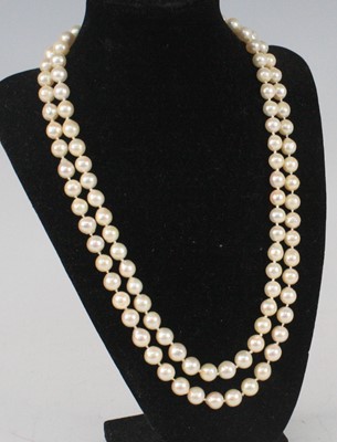 Lot 2319 - A two-row pearl necklace, featuring fifty-two...