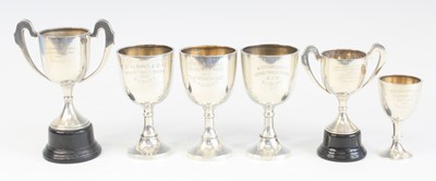 Lot 1255 - A collection of six George V. silver trophies,...