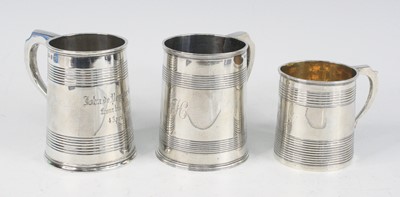 Lot 2262 - Three silver christening tankards, being a...