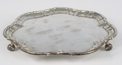 Lot 2283 - An Edwardian silver salver, of shaped circular...