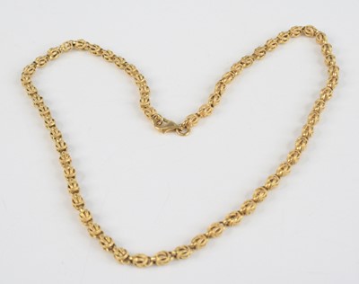 Lot 2383 - A contemporary yellow metal necklace, as...