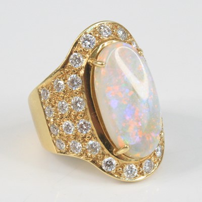 Lot 2333 - A modern yellow metal opal and diamond oval...