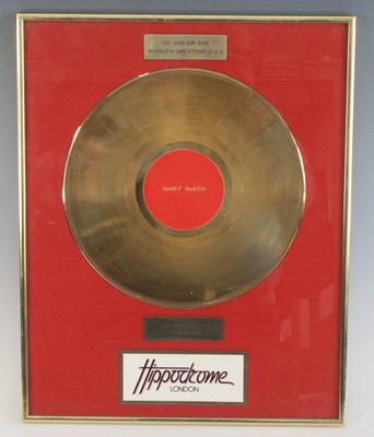 Lot 1147 - A presentation gold disc, awarded to Gary...