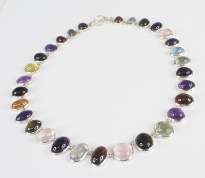 Lot 2350 - A white metal multi-stone necklace, featuring...