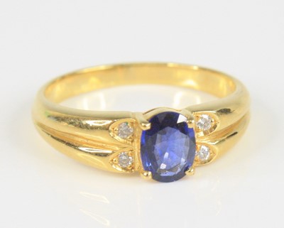 Lot 2381 - A yellow metal, sapphire and diamond ring,...