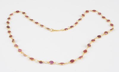 Lot 2382 - A yellow metal ruby multi-stone...