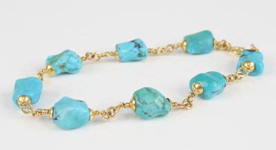 Lot 2405 - A yellow metal turquoise bracelet, having...