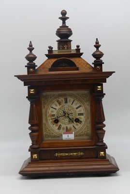 Lot 5 - An early 20th century walnut cased eight day...