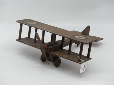Lot 8 - A vintage wooden model of a biplane, width 40cm