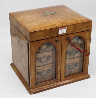 Lot 36 - A Victorian olivewood table-top dressing case,...