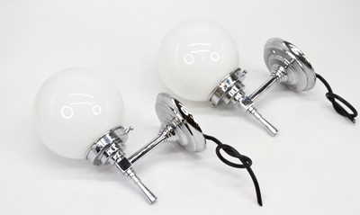Lot 58 - A pair of Art Deco style chrome wall lights...
