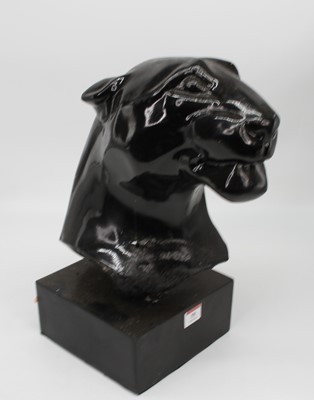 Lot 59 - A black painted composite head of a jaguar...