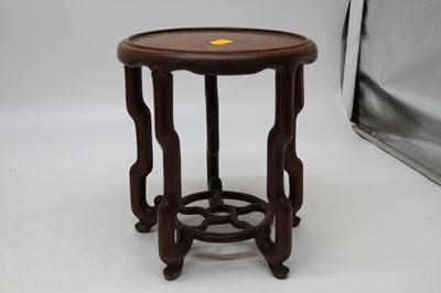 Lot 89 - A Chinese hardwood stand in the form of a...
