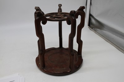Lot 89 - A Chinese hardwood stand in the form of a...