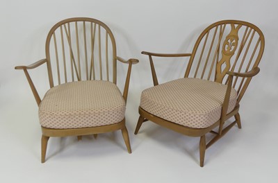 Lot 455 - An Ercol blond elm stickback open armchair,...