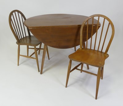 Lot 453 - A 1960s Ercol blond elm breakfast suite,...