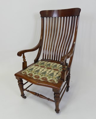 Lot 431 - An Arts & Crafts walnut slatback open armchair,...