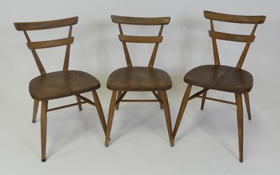 Lot 441 - A set of three 1960s Ercol blond elm...